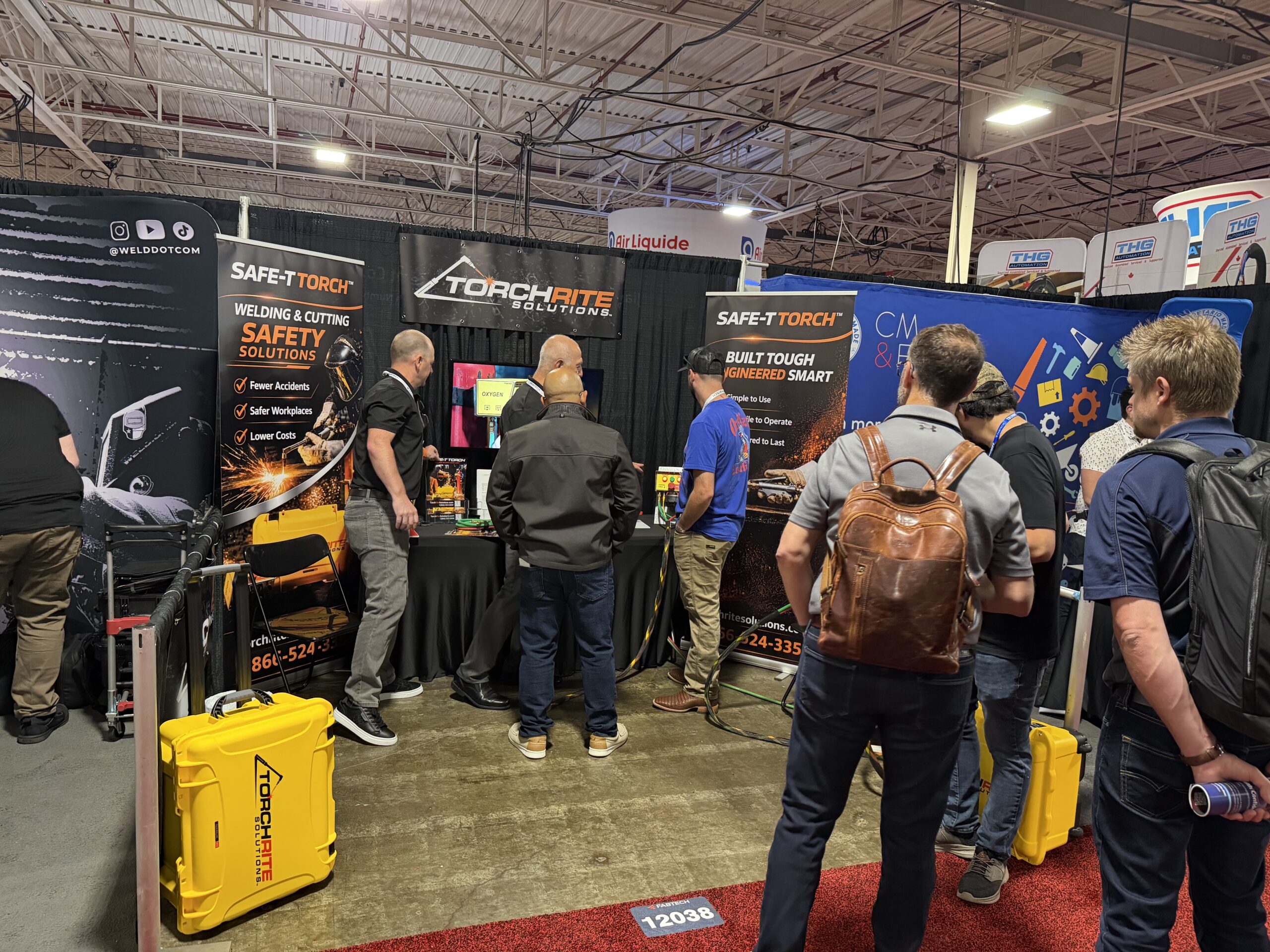 Visitors gathered at the TorchRite Solutions booth to watch a Safe-T Torch demonstration at FABTECH Canada 2026 in Toronto.